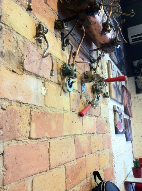 An "exploded" espresso machine on the wall